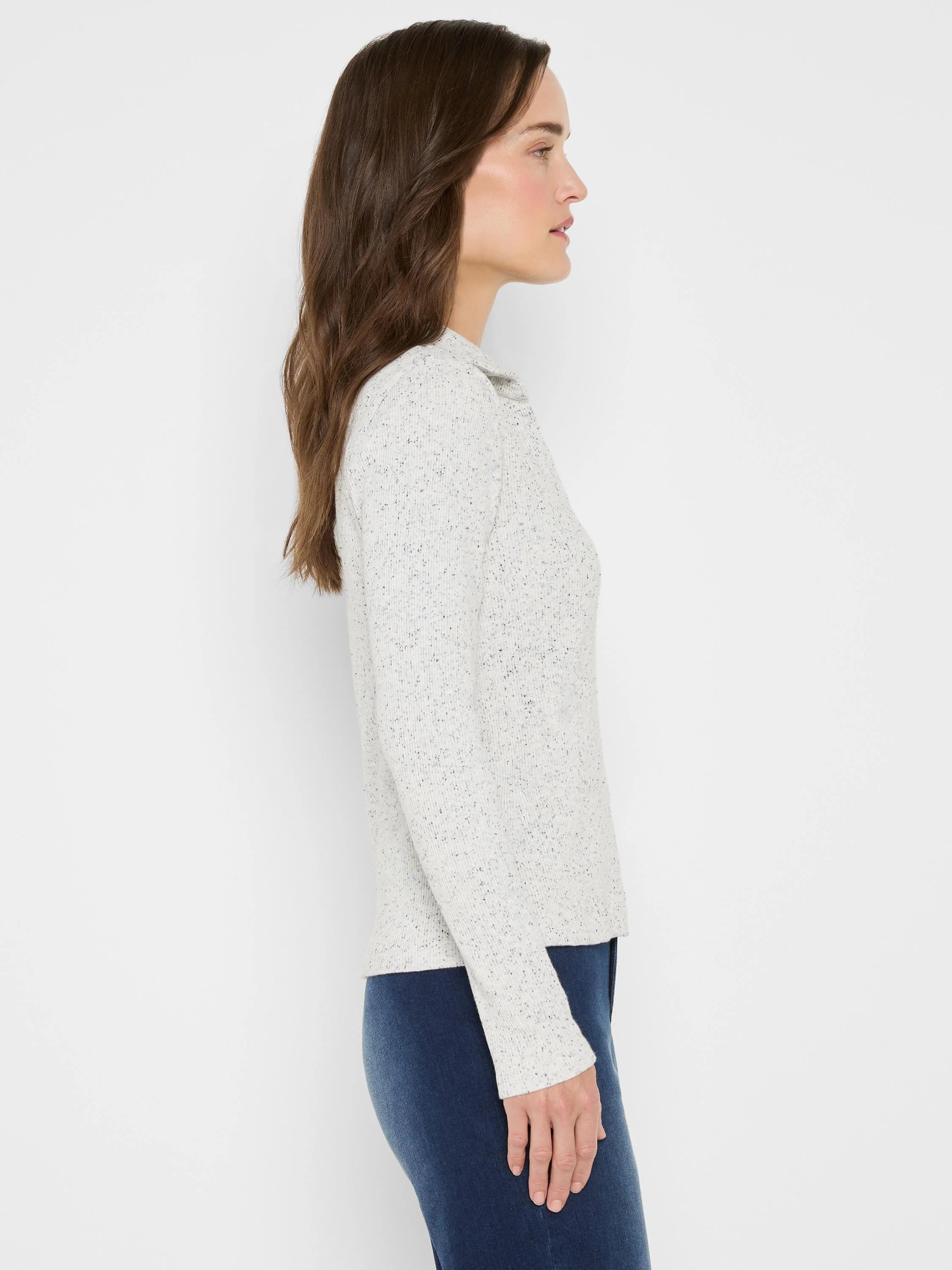 Light grey speckled ribbed long-sleeve polo shirt with a soft collar, worn by a woman.