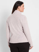 Pale pink flecked, ribbed long sleeve top with a mock neck.