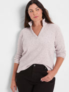 Speckled light pink ribbed long sleeve polo with V-neck and stand-up collar.