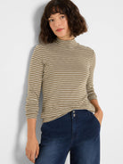 Olive green mock neck tee with horizontal off-white stripes and long sleeves.