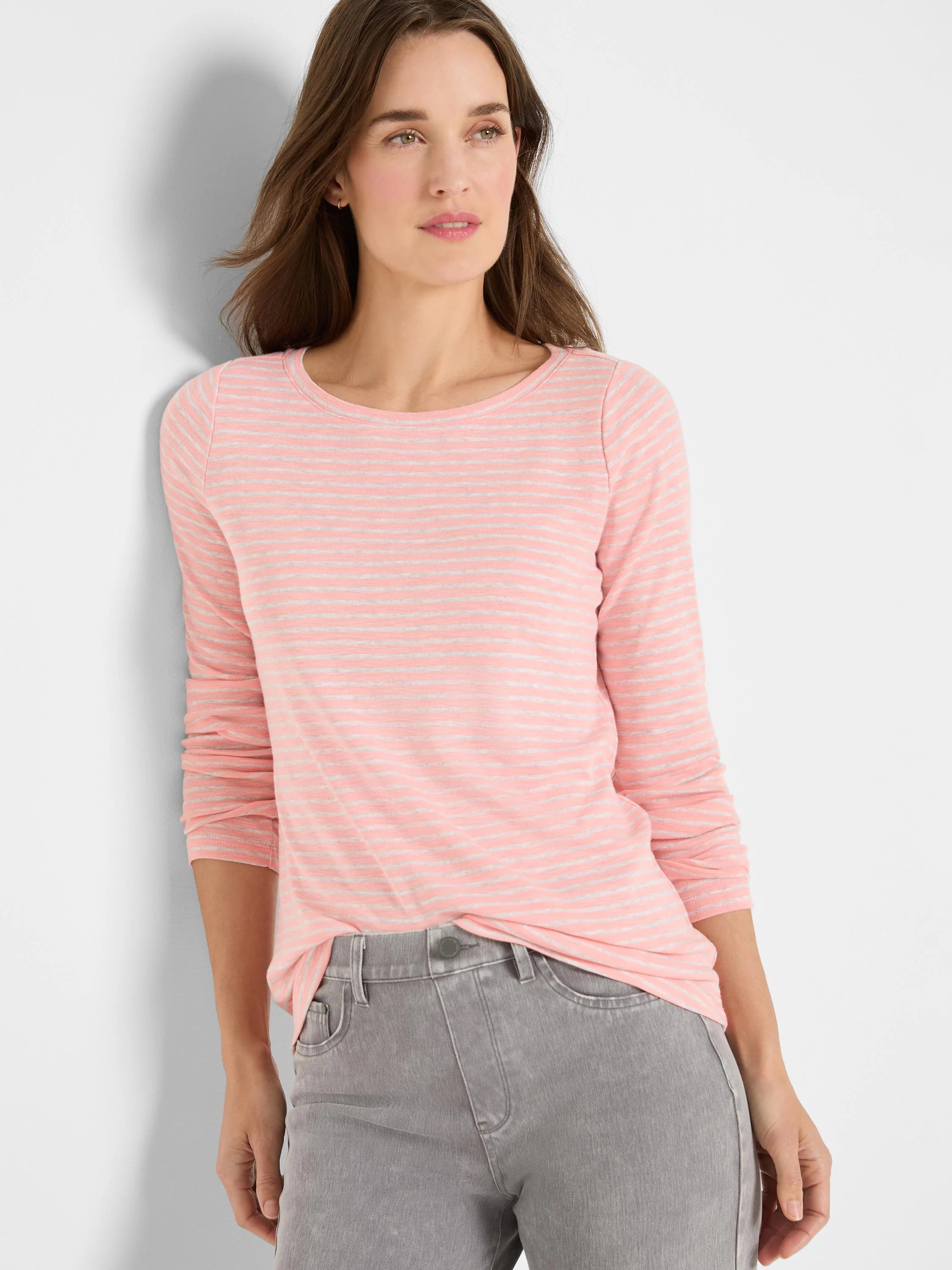 Light pink long-sleeve boat neck tee with thin light gray horizontal stripes.