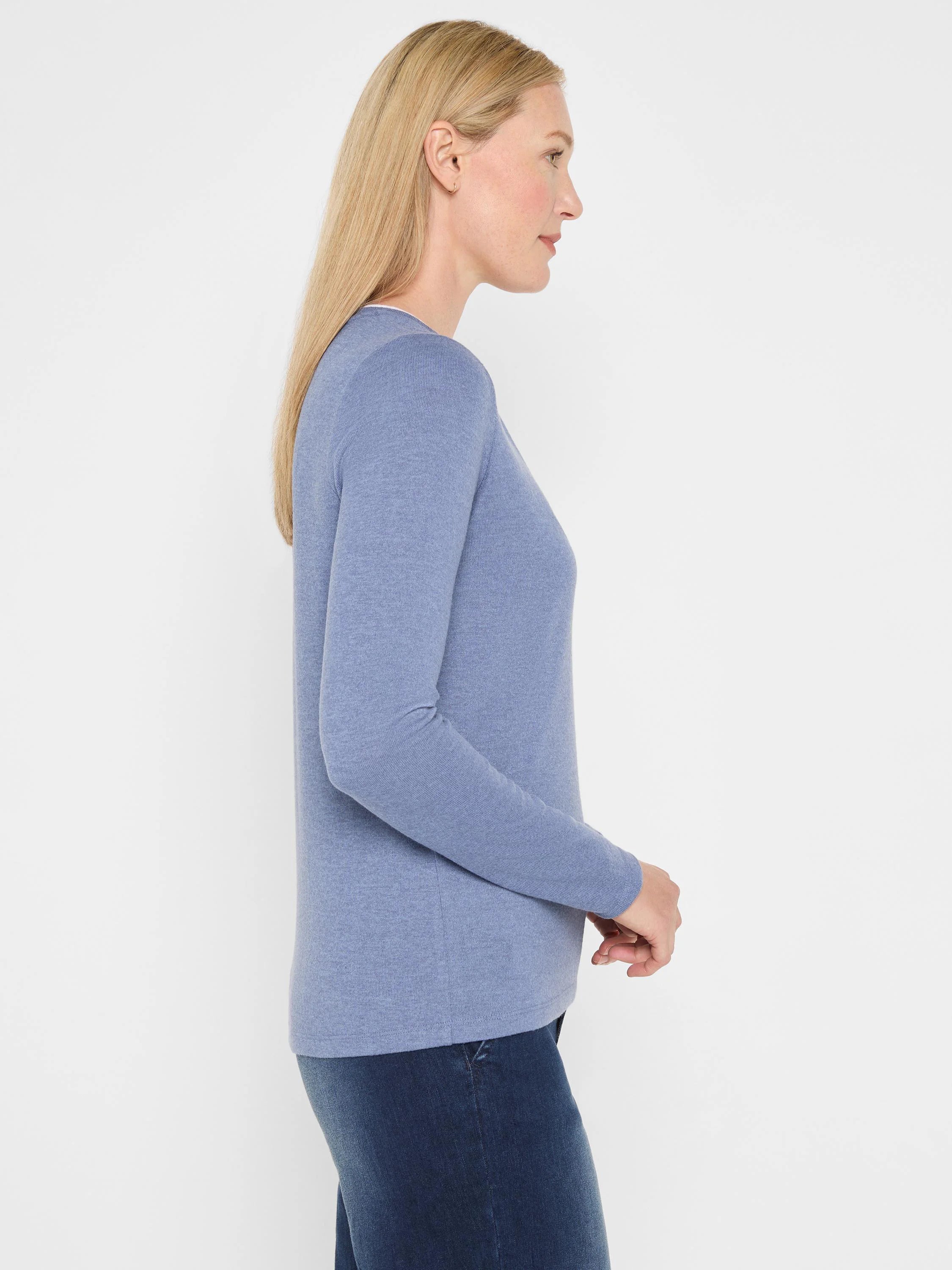 Light blue long-sleeve jersey tee, featuring a subtle split neck and soft texture. Relaxed fit.