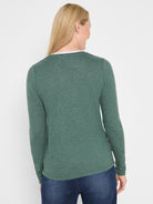 Dark heathered green long sleeve tee worn by a model, showing a white double layer visible at the back of the neckline.