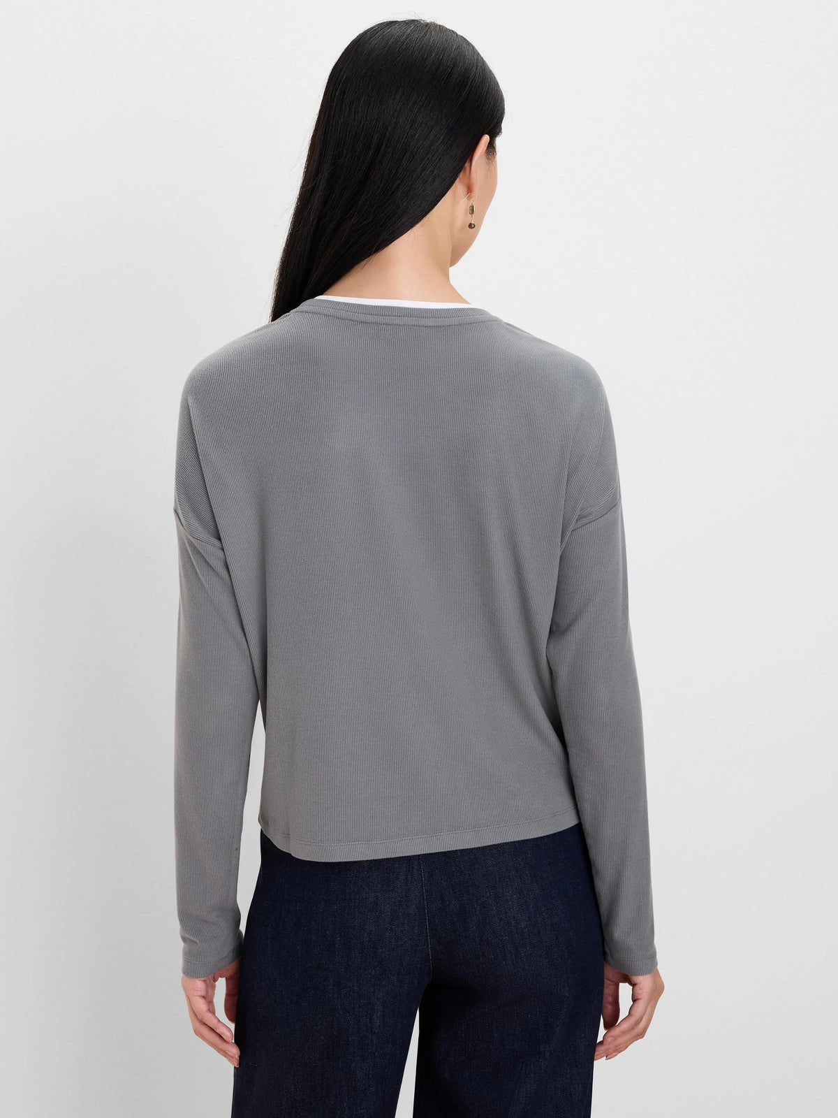 Gray ribbed long-sleeve top with white layer at crew neck.