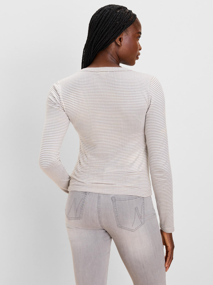 Fitted long sleeve tee with thin horizontal cream and light taupe stripes, subtle brushed finish.