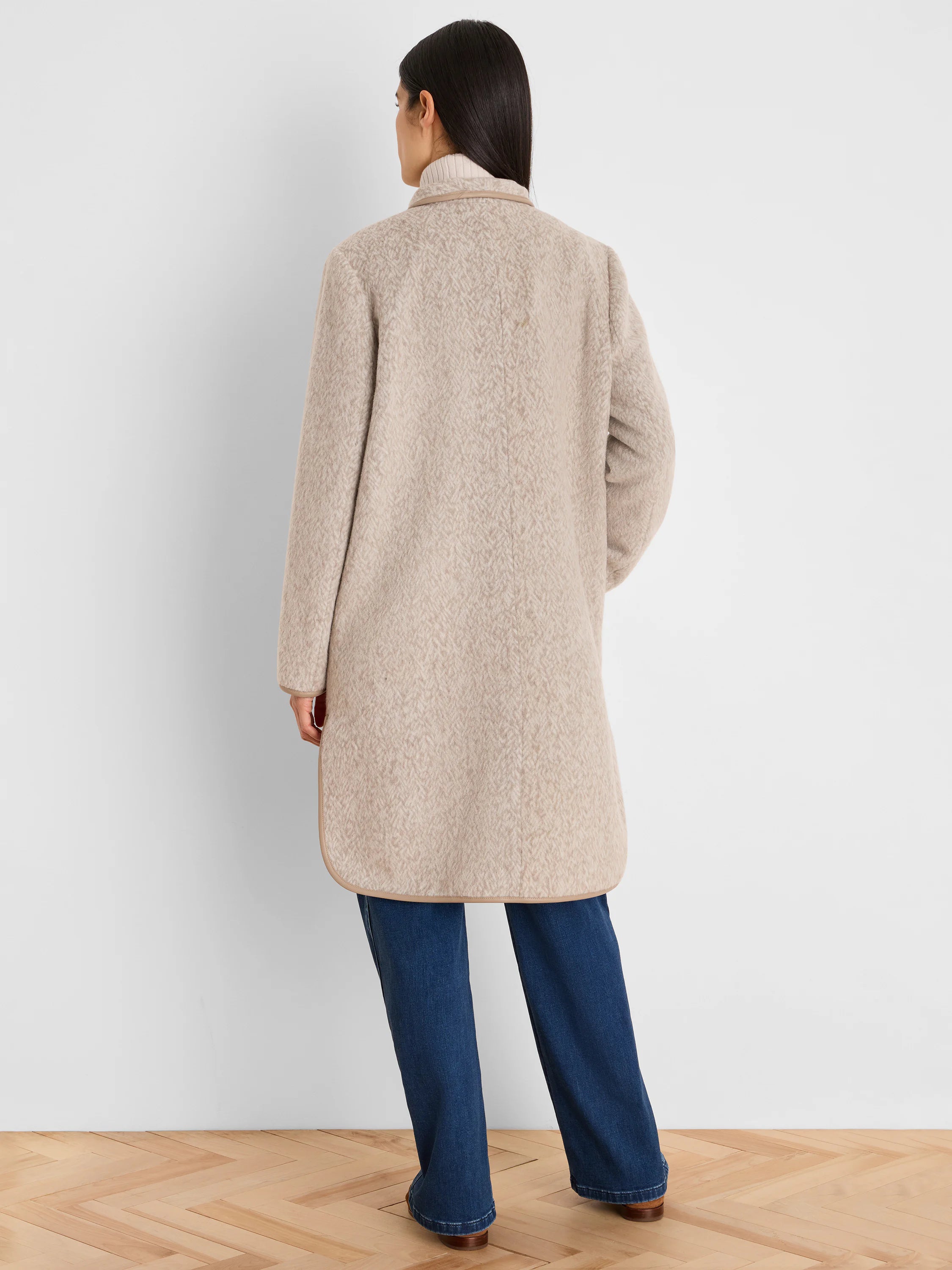 Light beige herringbone jacquard top coat with tan piping at collar and hem.