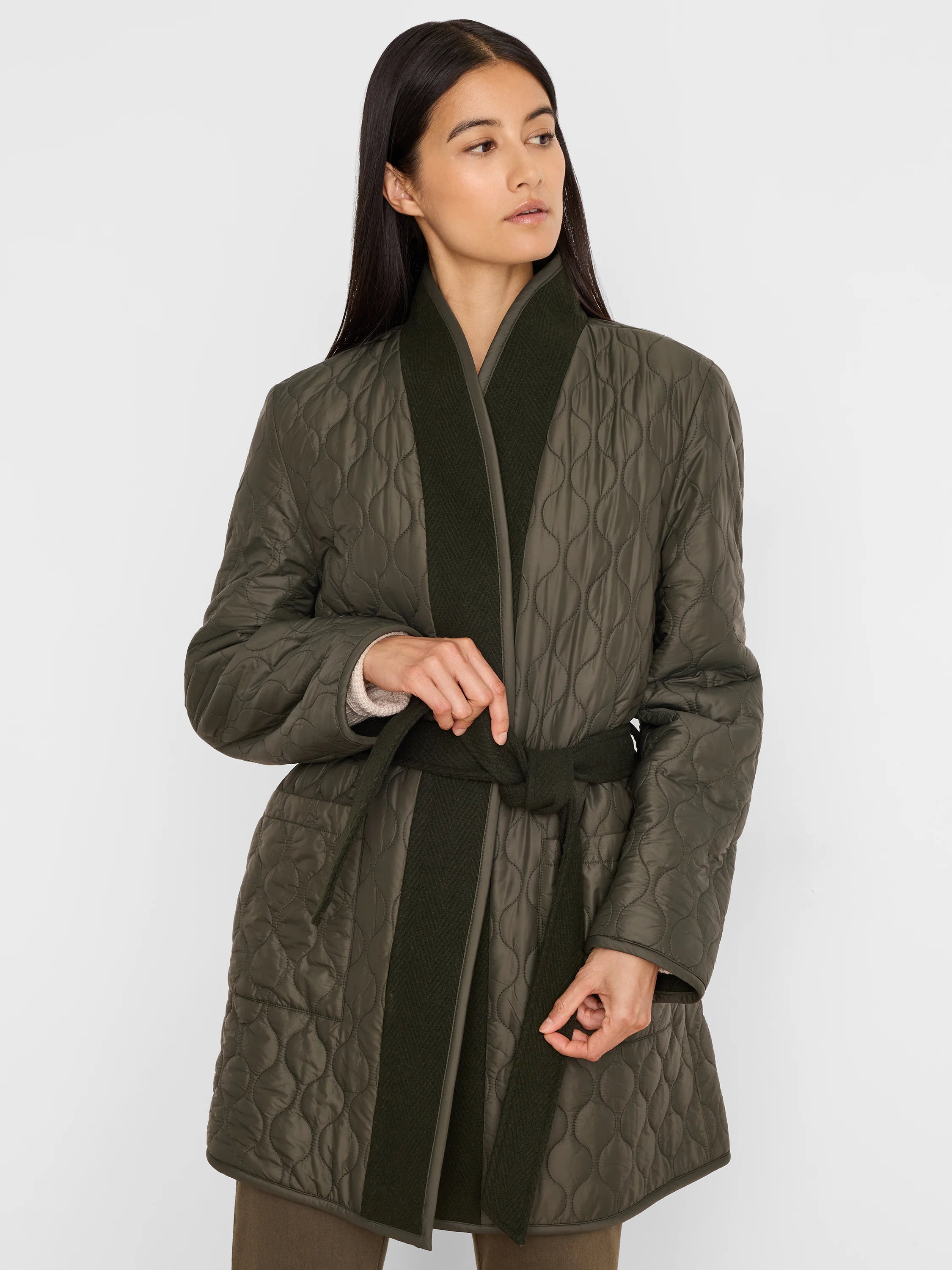 Reversible quilted olive green top coat with darker green wool lapels & tie-belt.