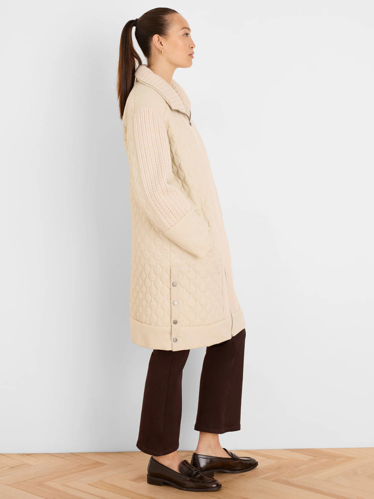 Light beige mixed media parka: quilted body, ribbed knit collar & sleeves, full zip, silver side snaps.