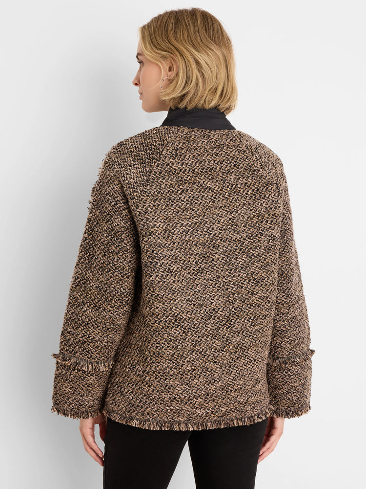 Brown, black, & tan mixed knit coat with a round neck and fringe at cuffs & hem.