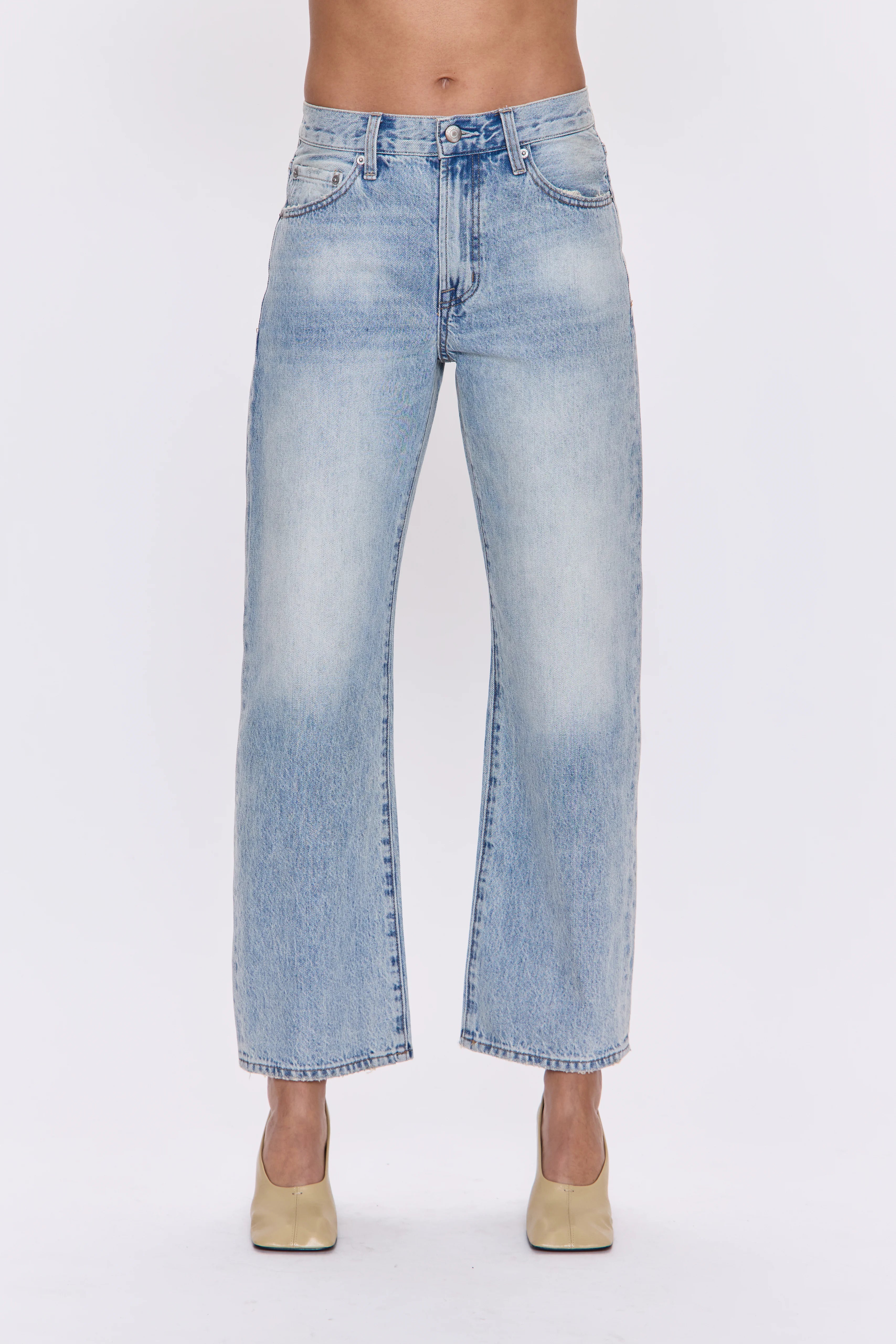 Light blue faded bowed straight-leg jeans with a raw hem.