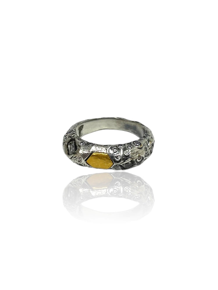 Vintage silver ring with a textured band and a central gold polygonal inlay.