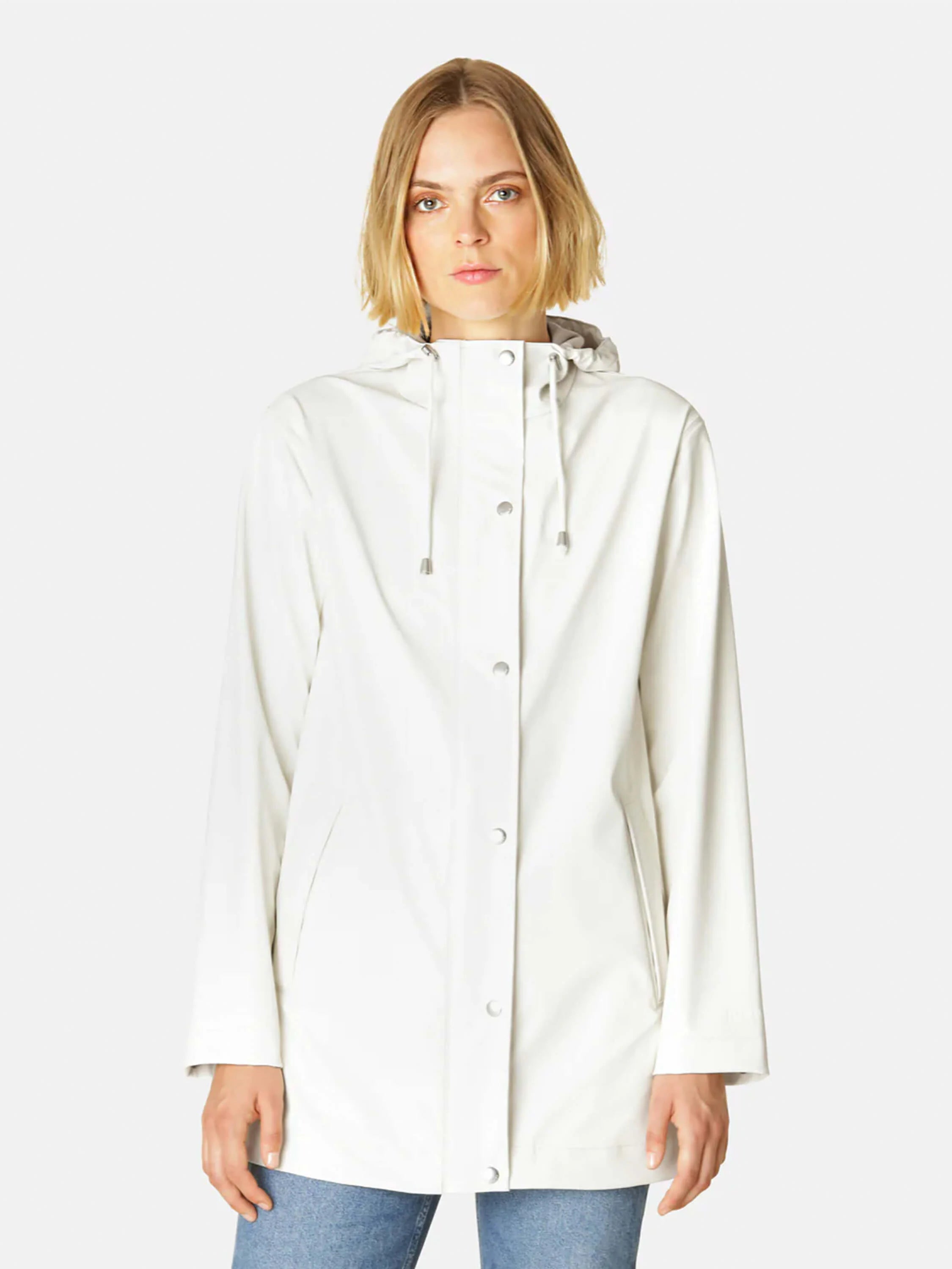 Off-white hooded raincoat with light grey snap closures. A woman models the coat.