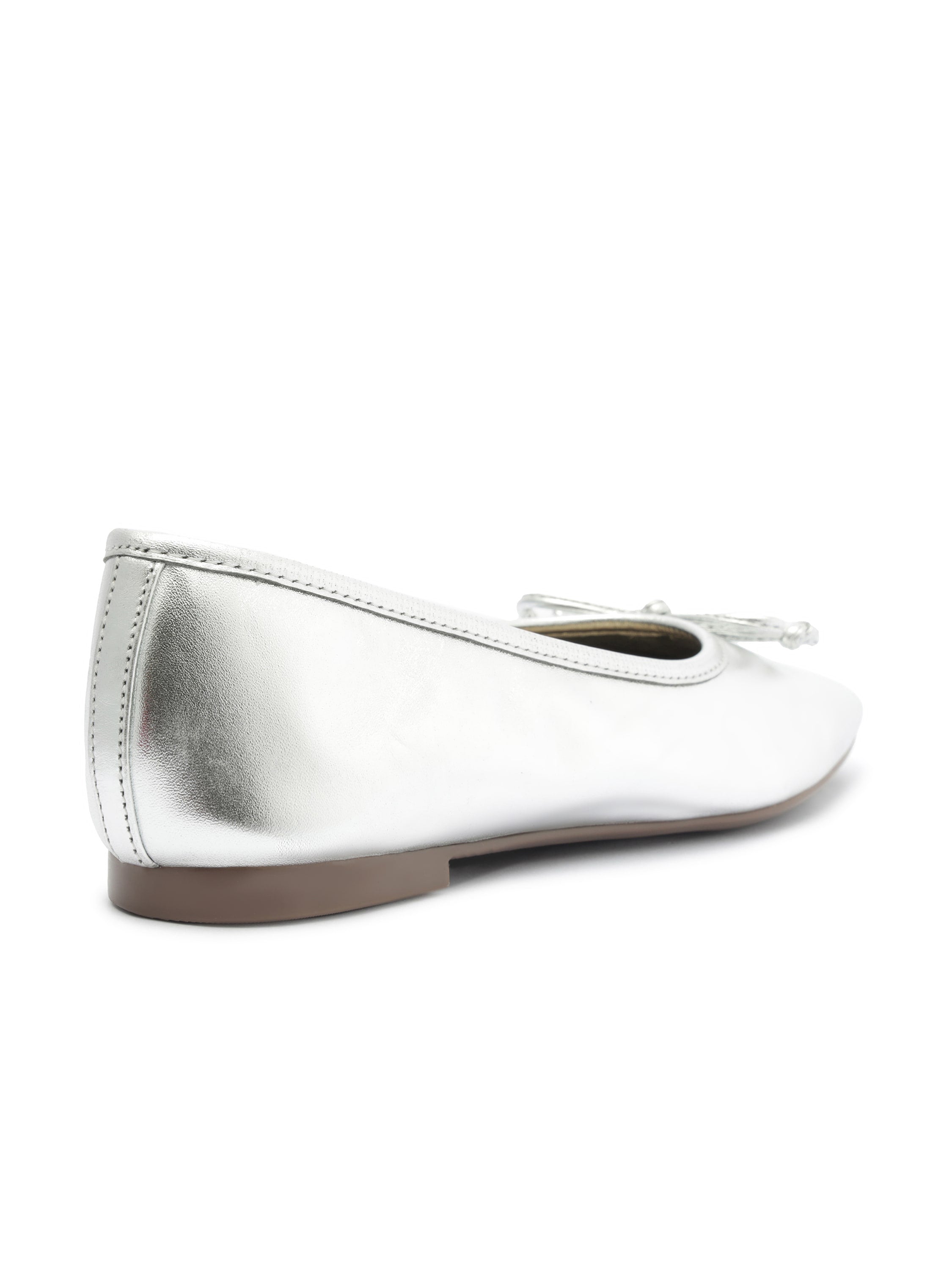 Silver metallic leather ballet flats featuring a rounded toe, minimal flat sole, and a tonal bow accent.