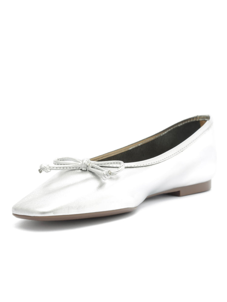 Metallic silver ballet flats feature a subtle square toe shape and a matching bow detail on the vamp.