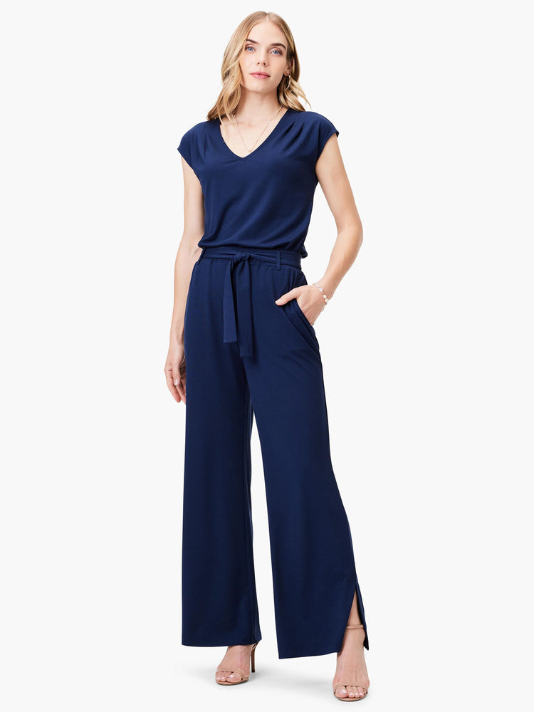 Navy blue wide-leg pants with a belted waist and side slits. Matching navy blue short-sleeved V-neck top.