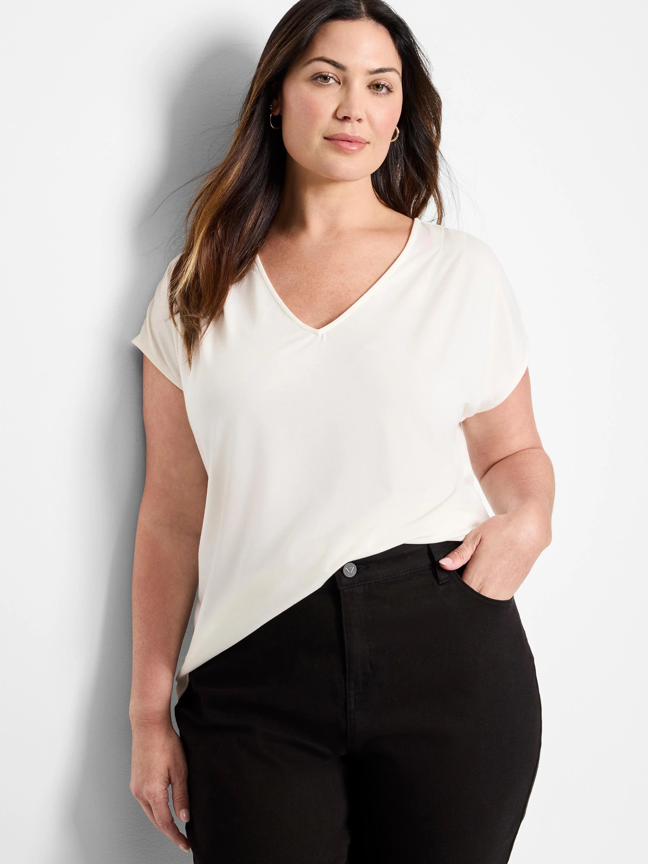 Off-white v-neck short-sleeve top.