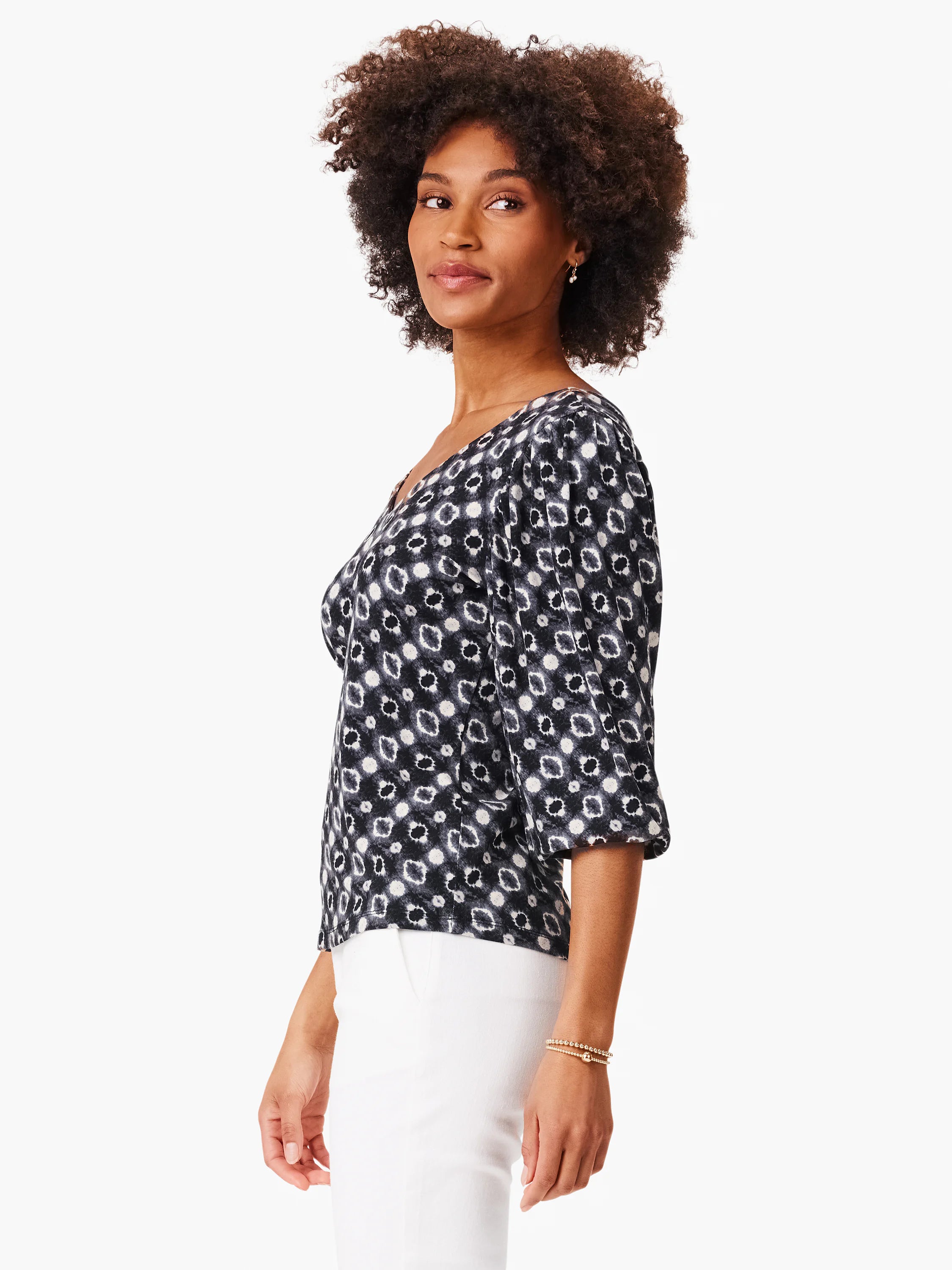 Black top with off-white shibori pattern, V-neck, 3/4 sleeves.