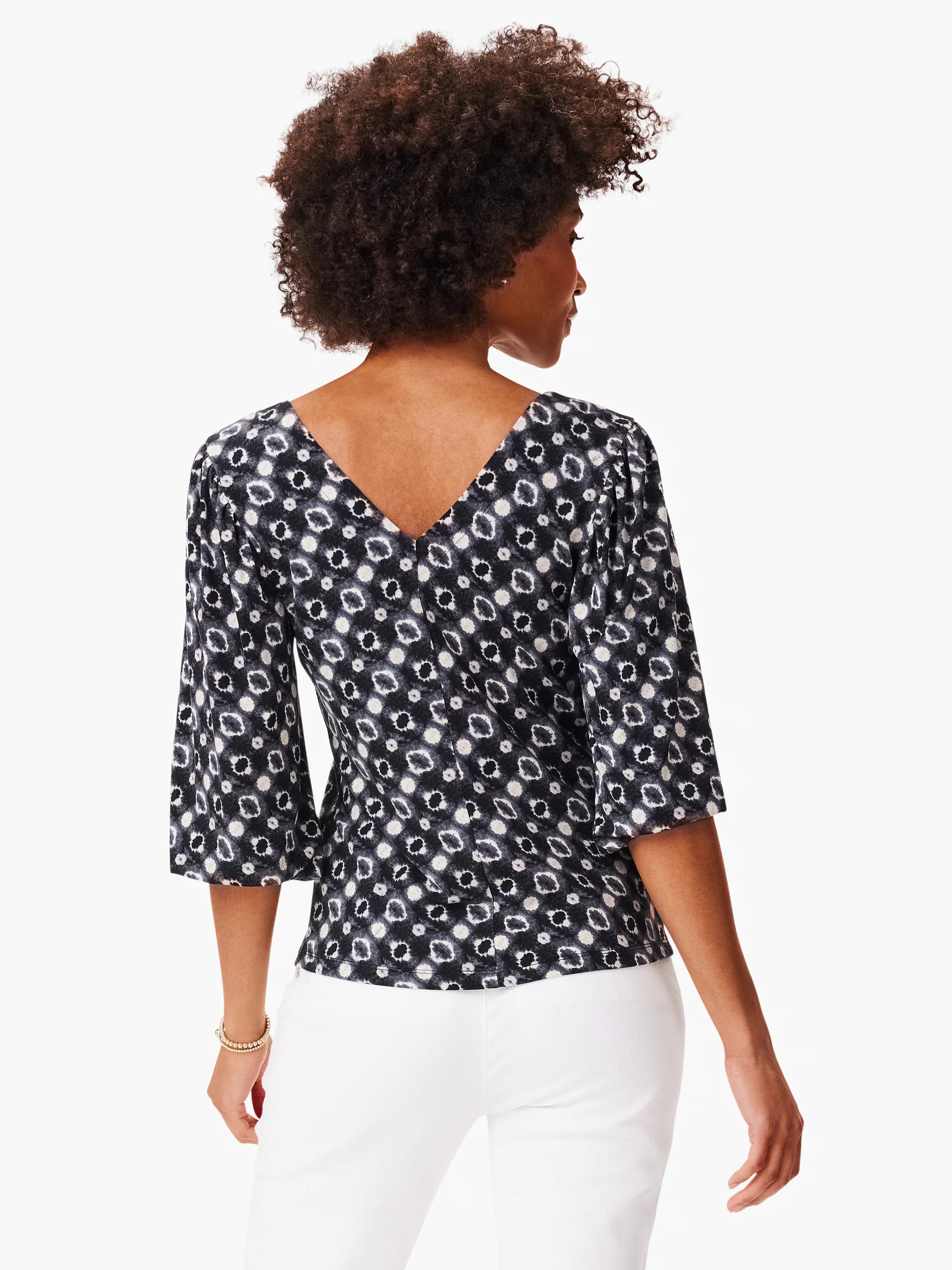 Black top with off-white shibori pattern, V-neck, 3/4 sleeves. Back view.