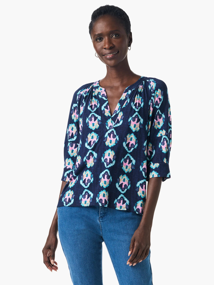 Navy blue top with teal, pink & beige batik print. V-neck, 3/4 sleeves.