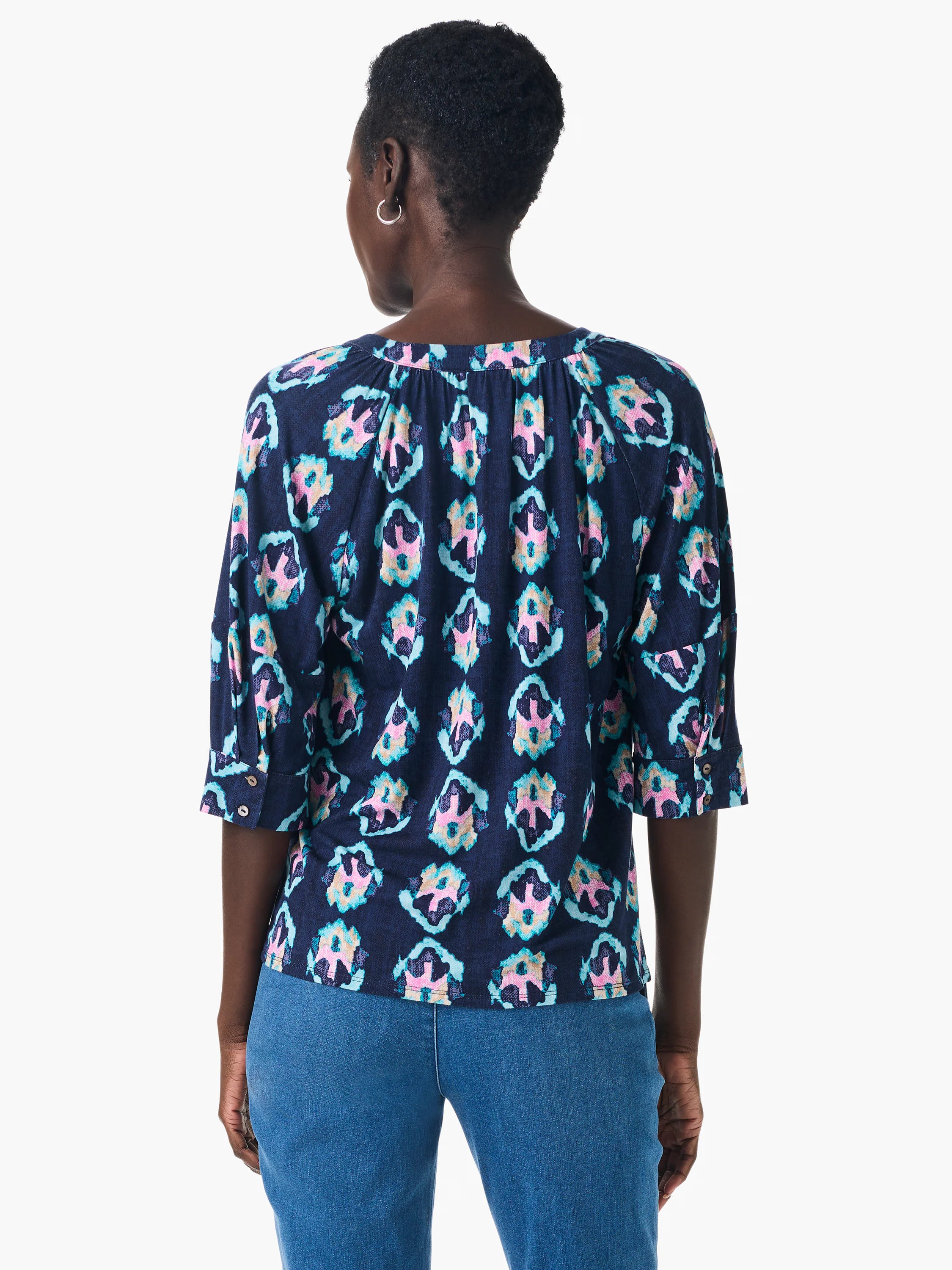 Dark navy top with teal, pink & beige batik pattern. Three-quarter sleeves, V-neck. Back view shown.
