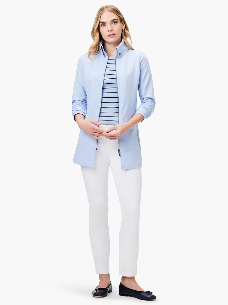 Light blue, high-neck zip-front tank top. Wide, dark stripes visible under the tank.