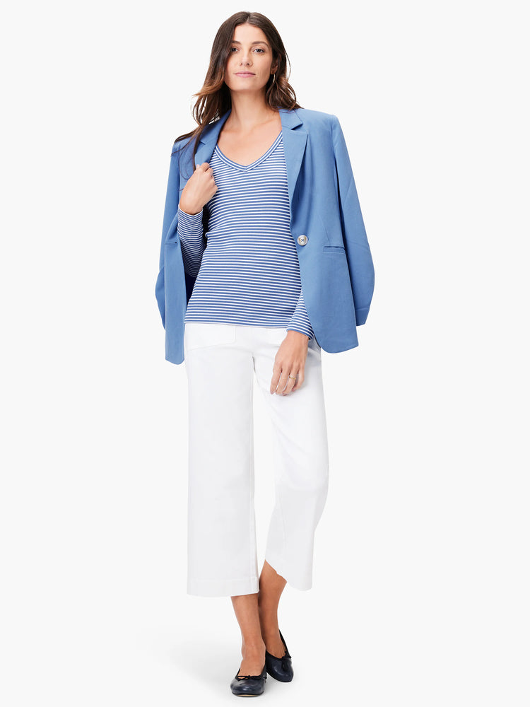 Here's alt text for the image, under 125 characters:
"Blue and white striped, long-sleeved V-neck knit shirt. Ribbed...
