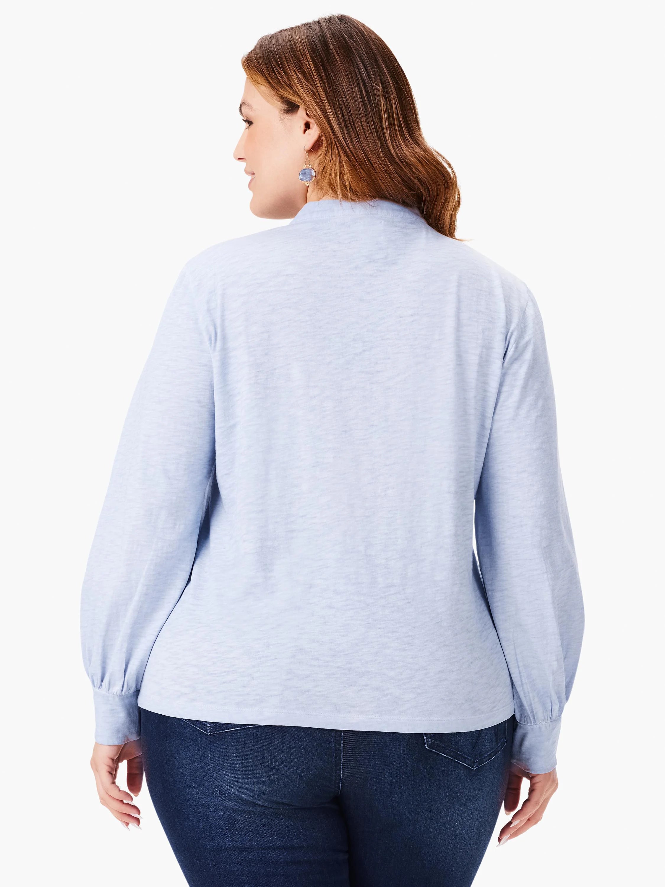 Light blue, long-sleeve top with slightly puffed sleeves and a mock neck. Back view.