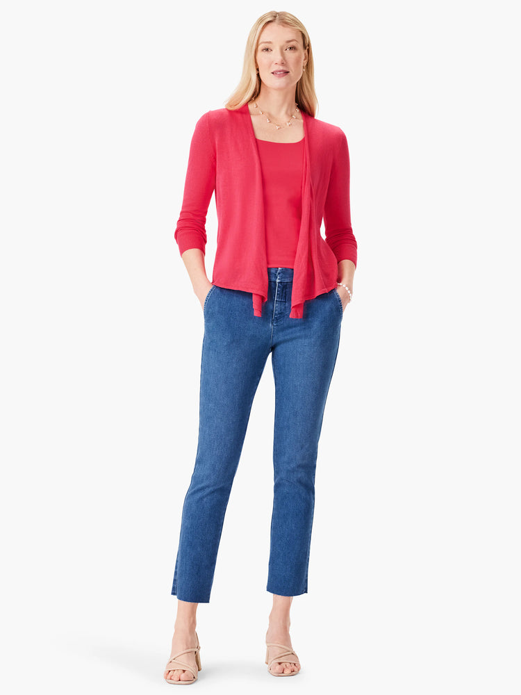 Coral red scoop neck tank top. Shown layered under a matching open knit cardigan.