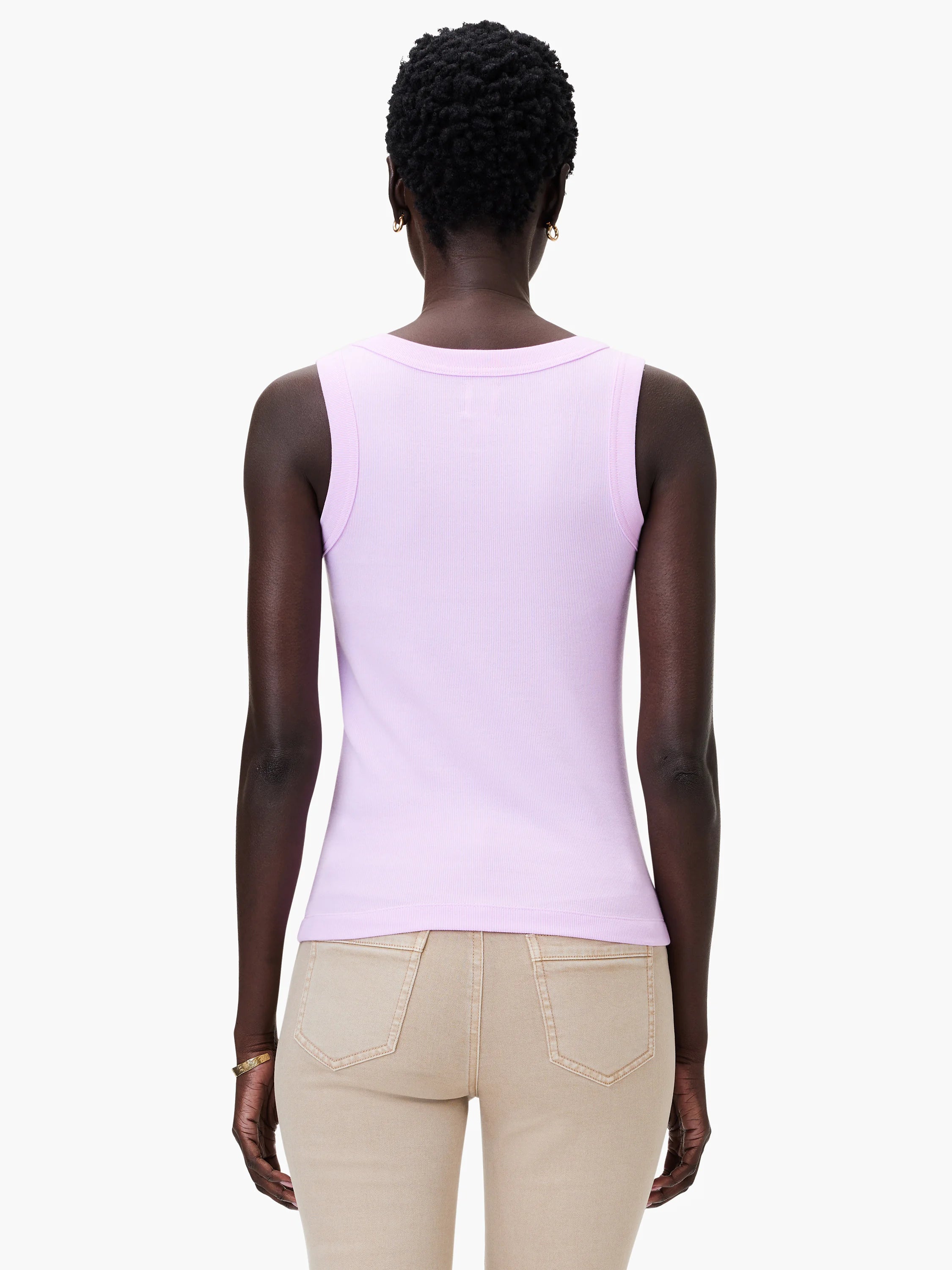 Light purple ribbed knit scoop tank, back view, worn by model. Paired with tan pants.