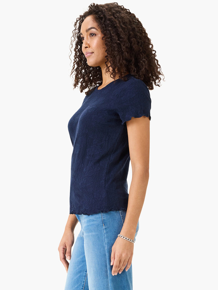 Navy blue lace-knit t-shirt. Short sleeves with scalloped edges. Textured fabric.
