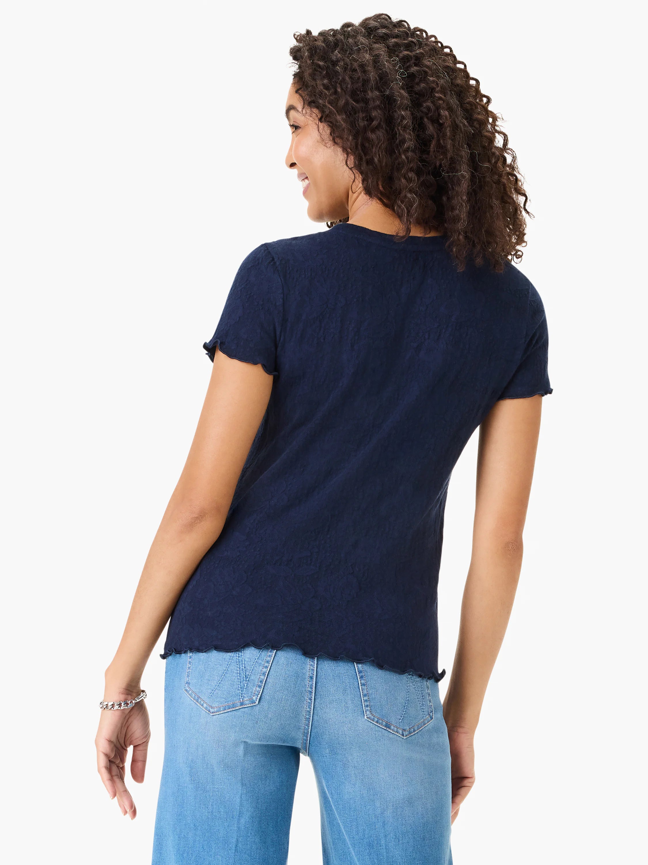 Dark navy blue lace-knit t-shirt; short sleeves with scalloped edges.