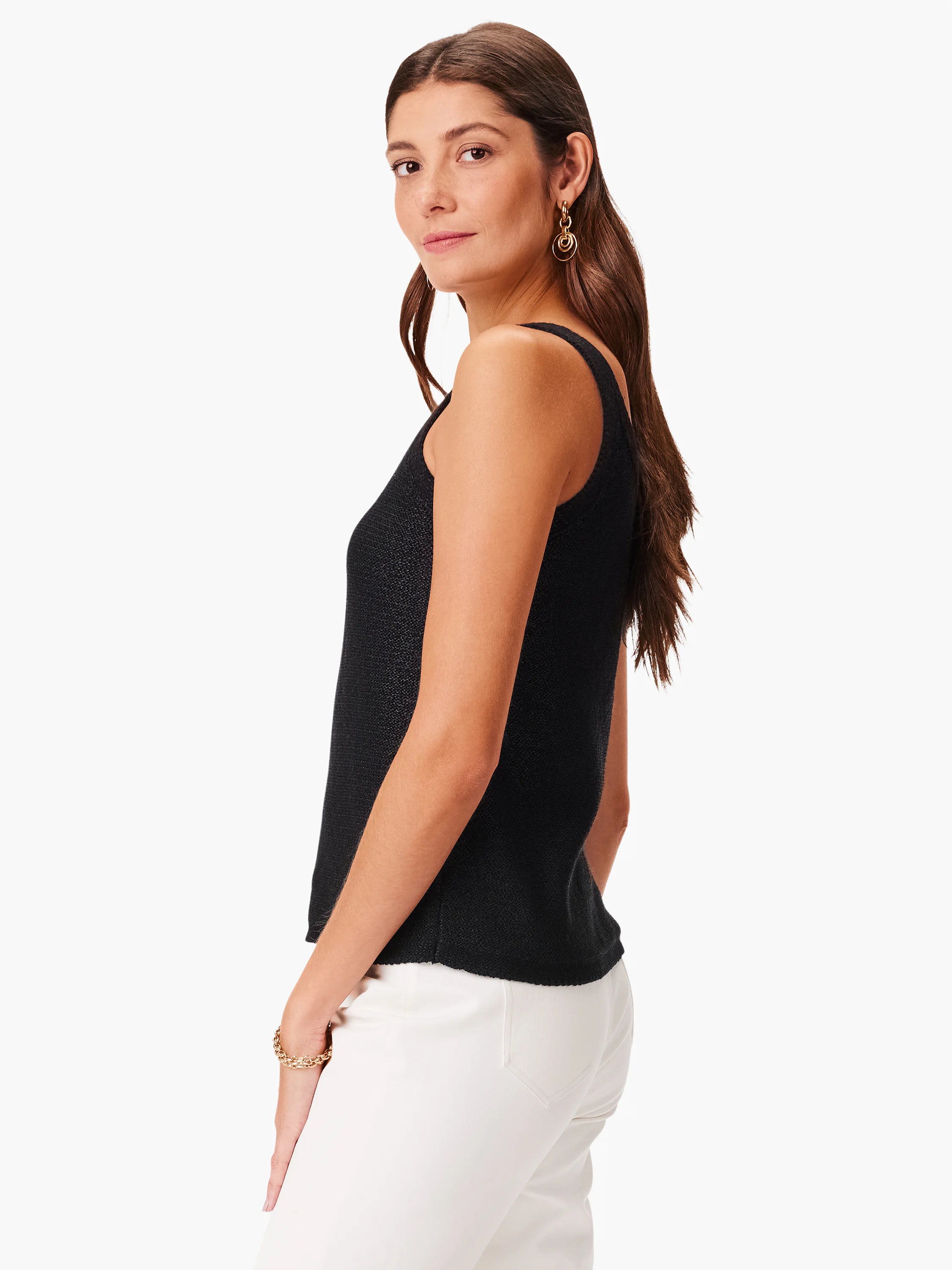 Black knit sleeveless top, straight neckline. Textured fabric.
