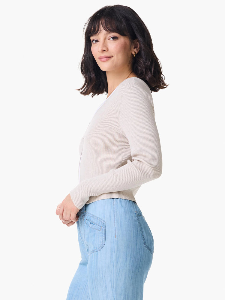 Beige ribbed cardigan, long sleeves, button front.