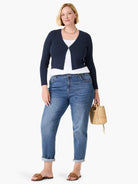 Navy ribbed knit cardigan, long sleeves, open V-neck, cropped length.