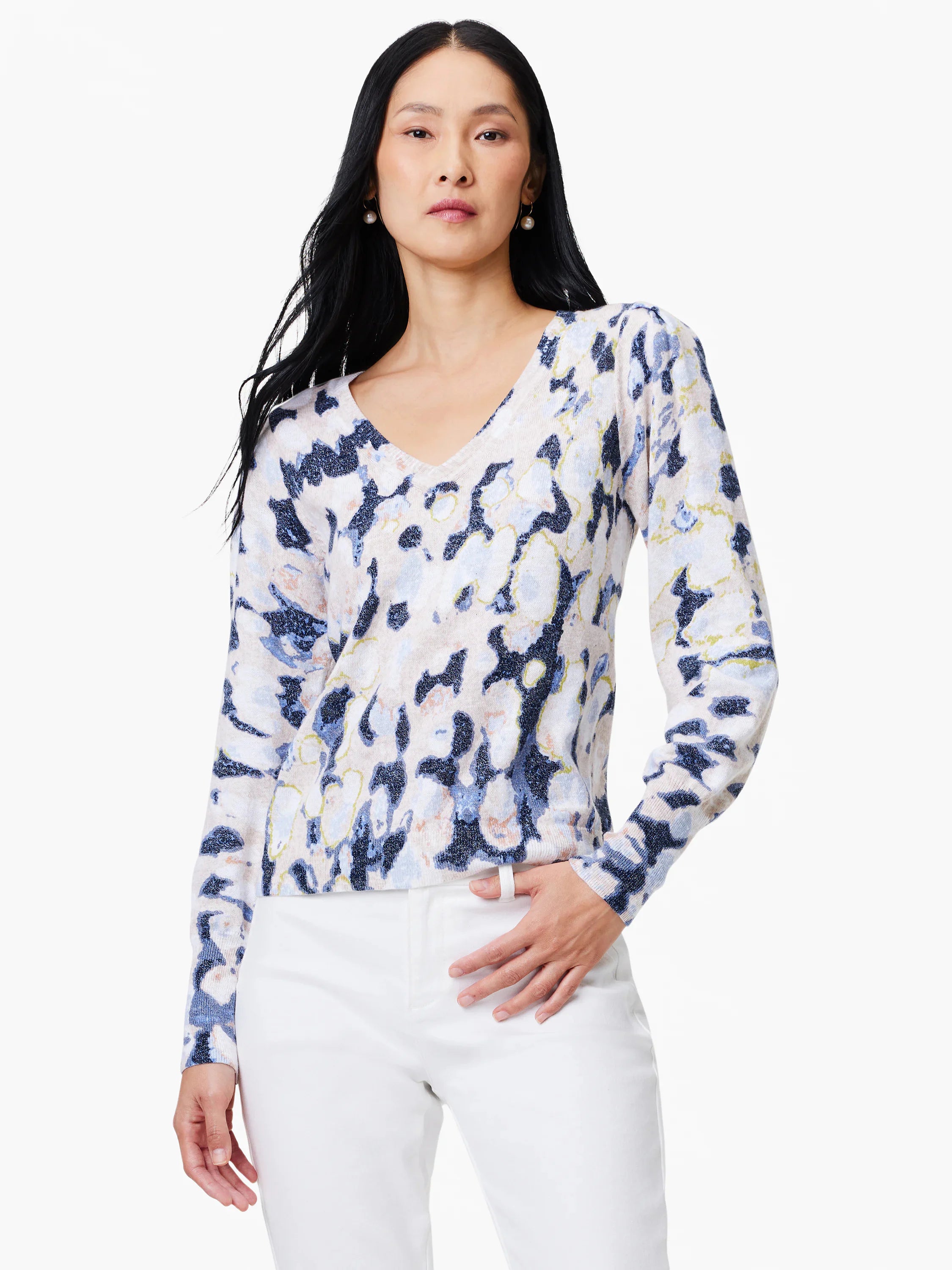 Beige sweater with blue, off-white, and gold abstract print. V-neck, long sleeves.