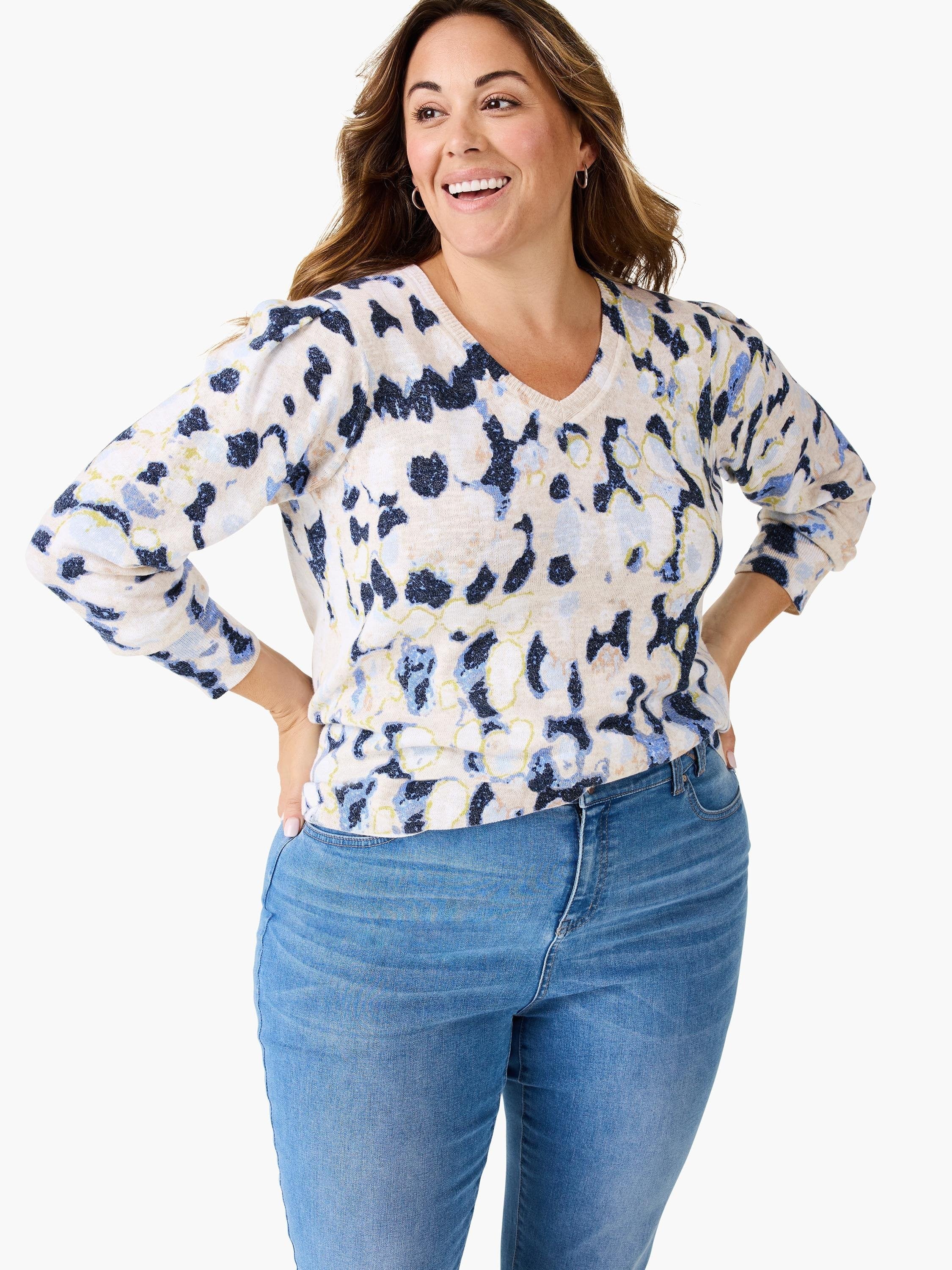 Beige sweater with blue and darker blue abstract print. V-neck, 3/4 sleeves.