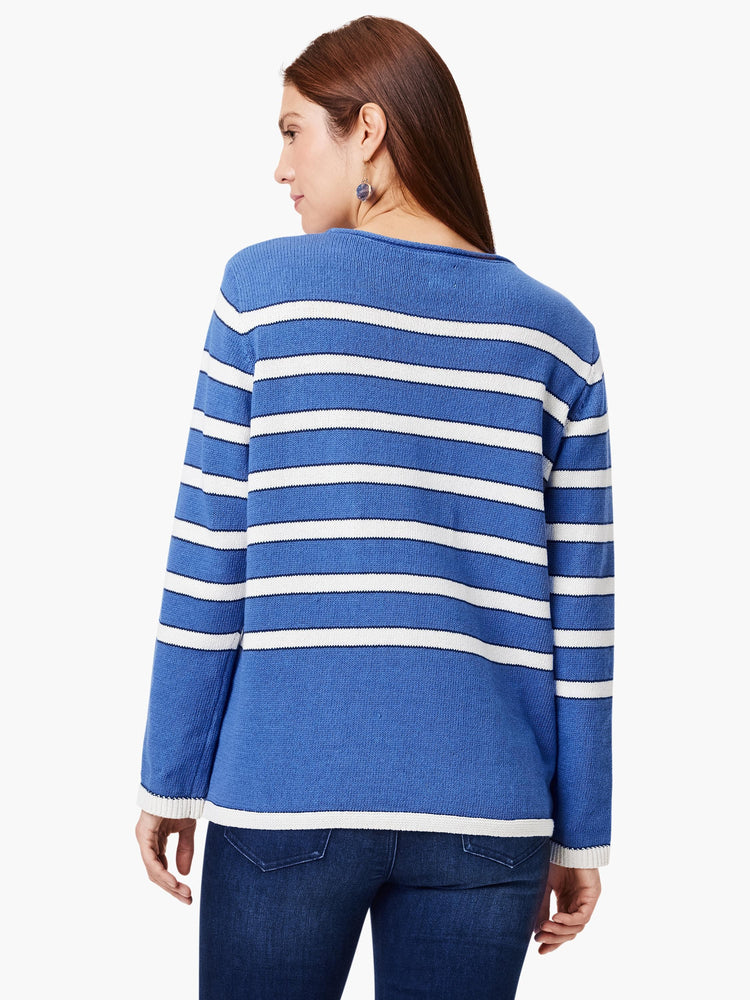 Blue sweater with white horizontal stripes and white cuffs. Long sleeves.