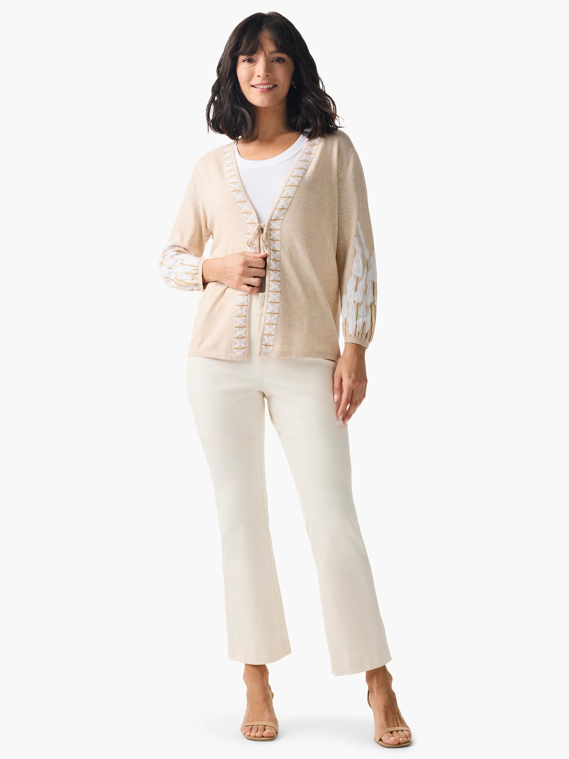 Beige cardigan with white and gold embroidered details on sleeves and front. Tie-front closure.