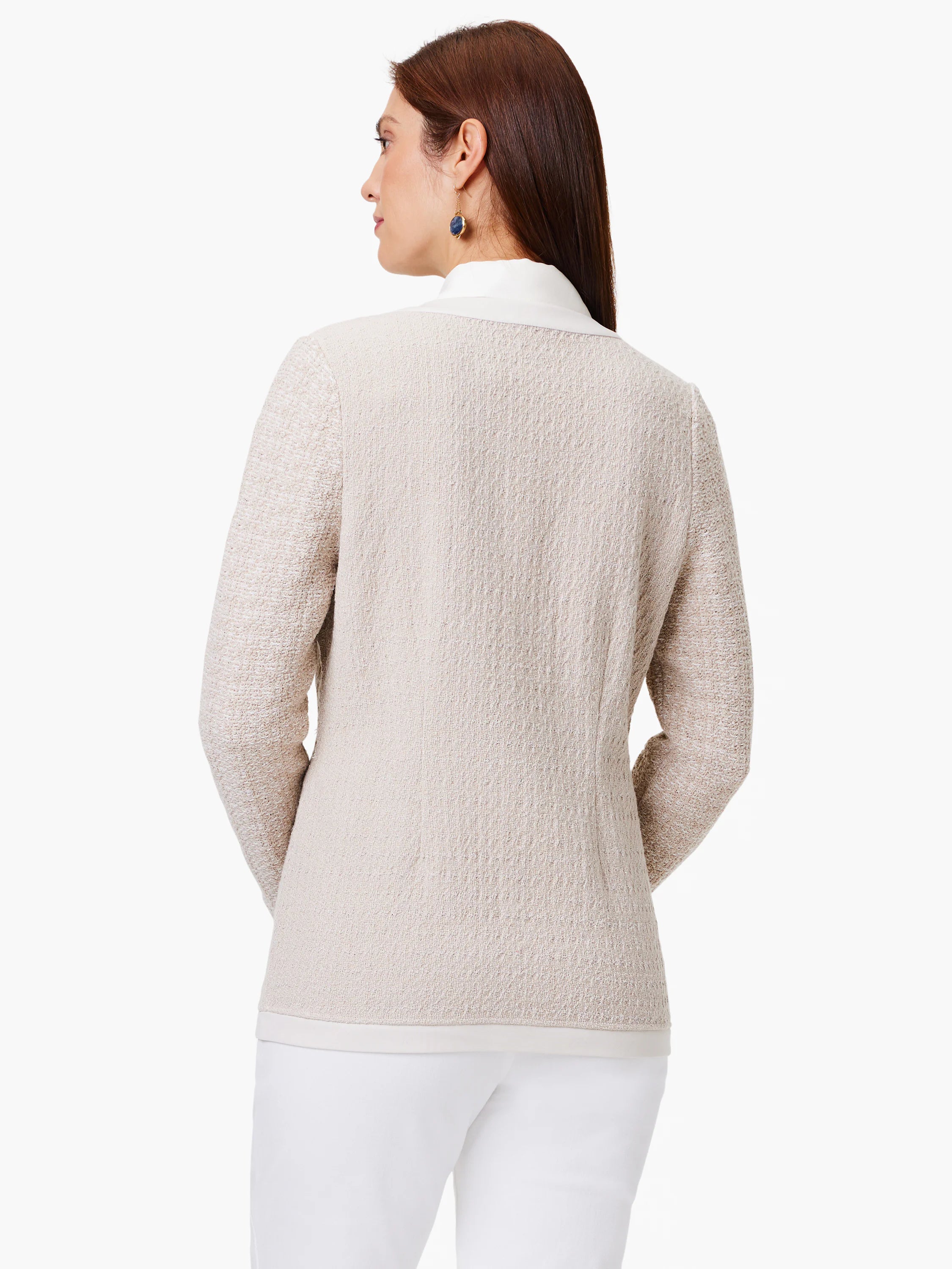 Beige knit jacket, open front, long sleeves, textured fabric. White underlay visible at collar and hem.