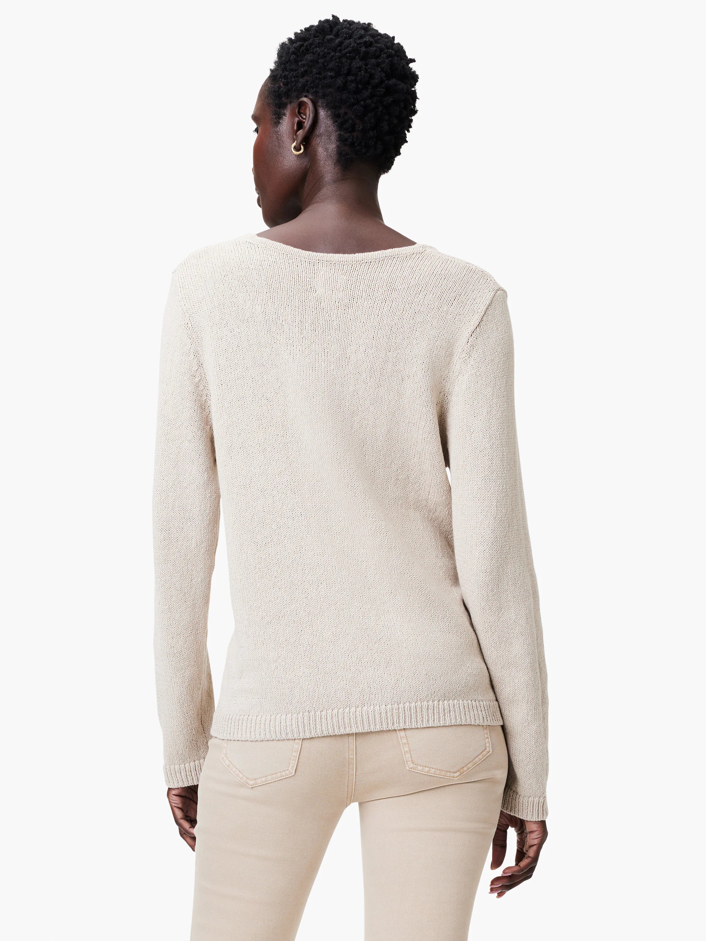 Oatmeal cotton cord sweater, back view. Fine ribbed knit, long sleeves, and a gentle scoop neck.