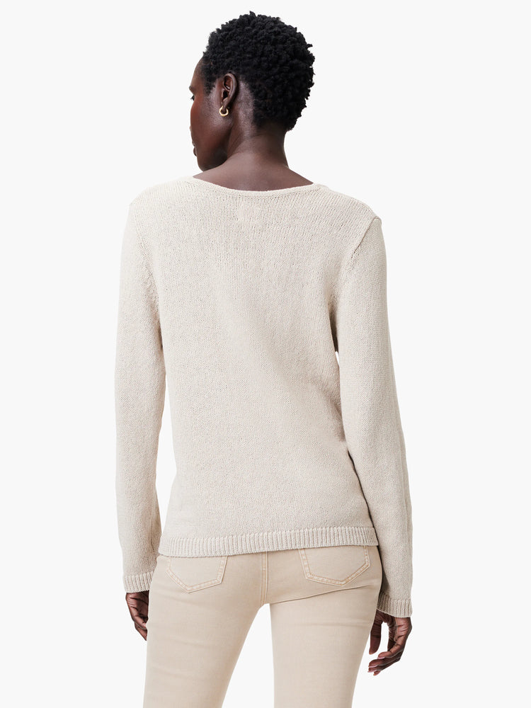 Oatmeal cotton cord sweater, back view. Fine ribbed knit, long sleeves, and a gentle scoop neck.
