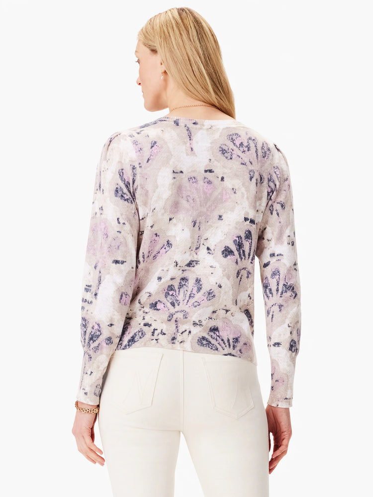 Beige sweater with purple and gray abstract floral print. Long sleeves, slight puff shoulders.