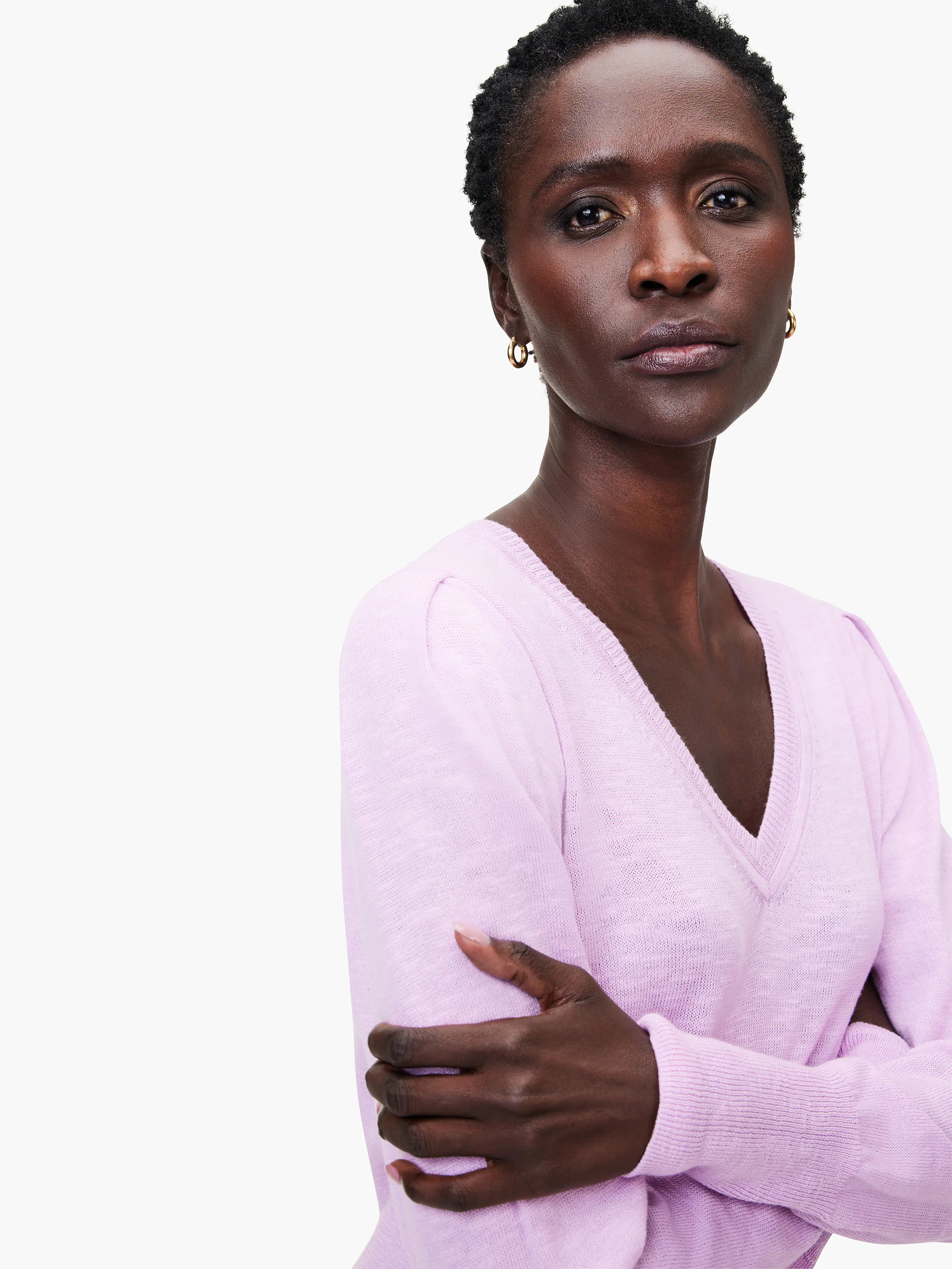 Light purple slub V-neck sweater; long sleeves, close-fitting.