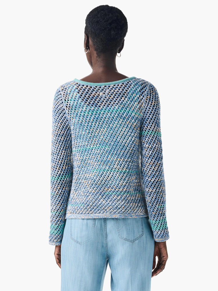 Back view of light blue, beige, and teal crochet sweater. Open, net-like pattern. Long sleeves.