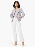 Light grey mix knit jacket with fringe trim at edges and cuffs, featuring buttoned flap pockets.