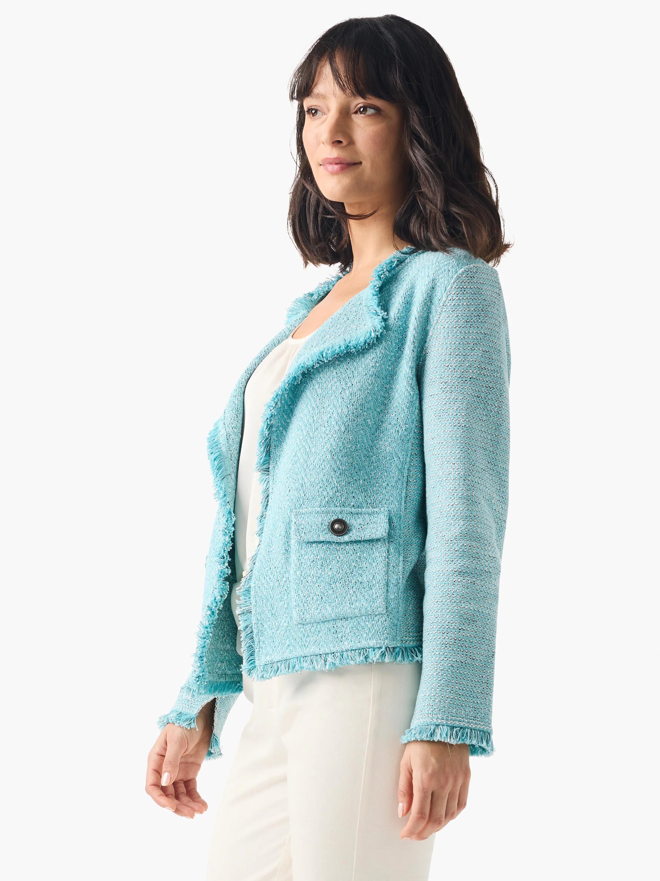 Light blue mixed knit jacket with fringe edges on collar, front, hem, and cuffs. Features one buttoned patch pocket.