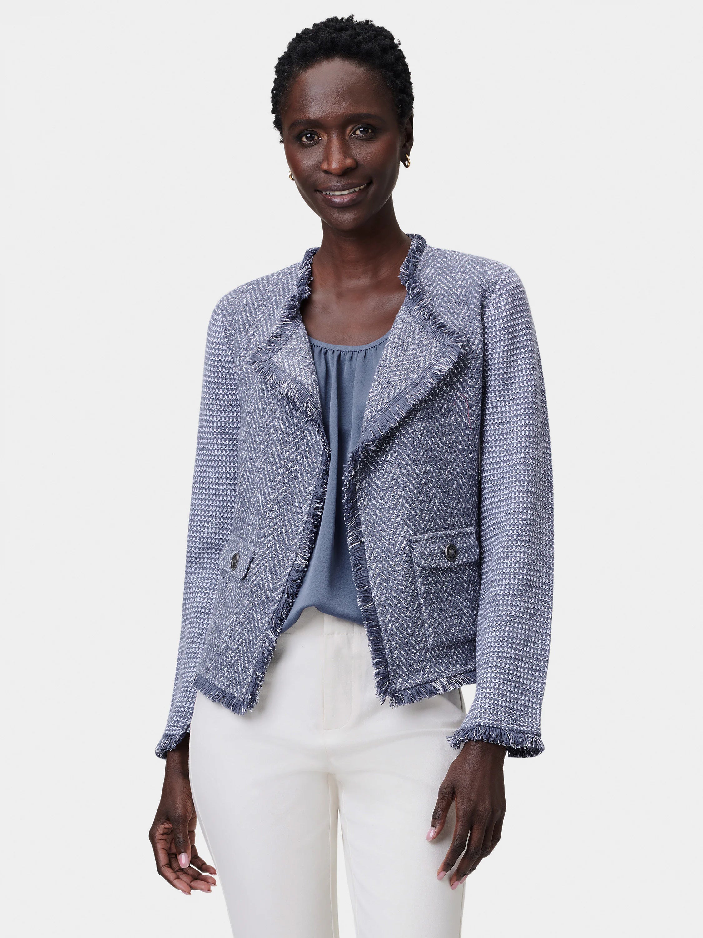 Blue-gray textured knit jacket with fringe trim at edges and two front patch pockets.