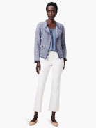 Blue mix knit jacket featuring fringe trim on edges and two front flap pockets.