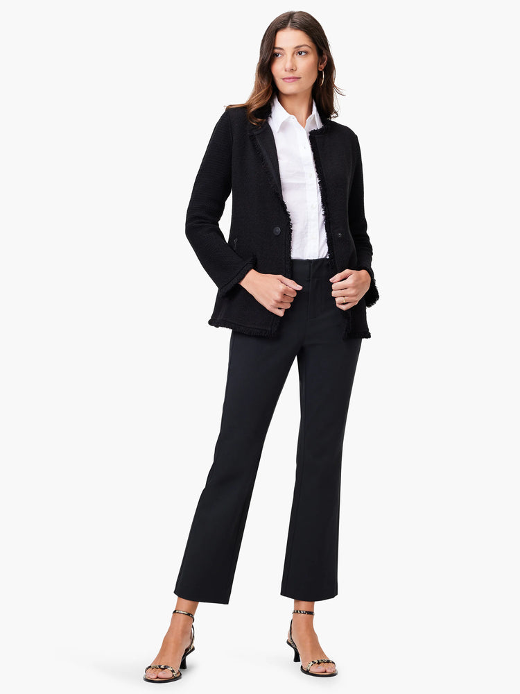 Black knit jacket with long fringe trim. Single button closure.