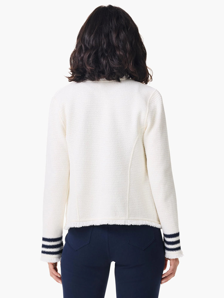 Off-white knit jacket with navy stripes on cuffs, fringed hem. Textured fabric.